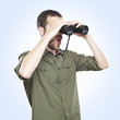 young man looking through binoculars, surprise face expression