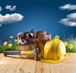 construction tool and helmet on blue nature background