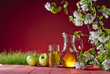 apple juice and grass on a red background