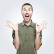 portrait of a young beautiful man surprised face expression