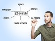 young casual man writing a job search diagram  on glass board