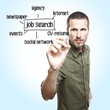 young casual man writing a job search diagram  on glass board