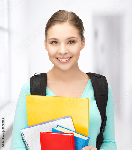 Photo: student with books and schoolbag student with books and schoolbag