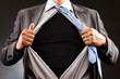 Conceptual image of a man tearing off his shirt