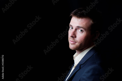 Photo: Low-key studio portrait of a business man Low-key studio portrait of a business man