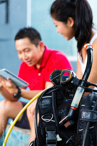 Photo: Dive master and student in Asian diving school Dive master and student in Asian diving school
