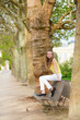 Girl sitting on a bench in park
