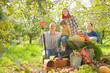 Happy  family with  harvest in  garden