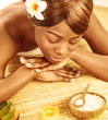 African woman in spa salon