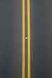 double yellow lines divider on blacktop