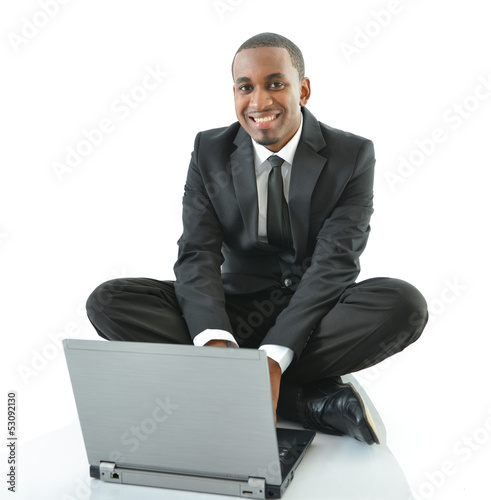 Photo: Businessman Sitting on Floor Working on Laptop Businessman Sitting on Floor Working on Laptop