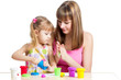 kid girl and mother playing colorful clay toy