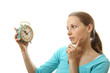 woman with alarm clock, isolated on white