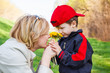 Mother and little boy with flower