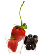 strawberry and blueberry in transparent jars