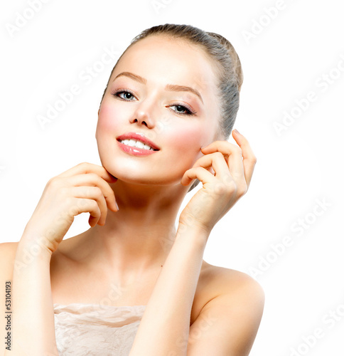Photo: Beautiful Young Woman with Fresh Clean Skin touching her Face Beautiful Young Woman with Fresh Clean Skin touching her Face