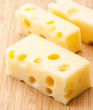 Emmental cheese tacos on wood