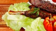 served ribs with cutlery on wooden table 1920x1080 intro motion 