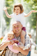 Photo: happy father with two adorable daughters happy father with two adorable daughters