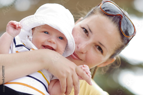 Photo: smiling baby on mother's hand's smiling baby on mother's hand's