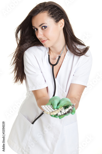 Photo: woman doctor with pills in hand. Female doctor holding many pil woman doctor with pills in hand. Female doctor holding many pil