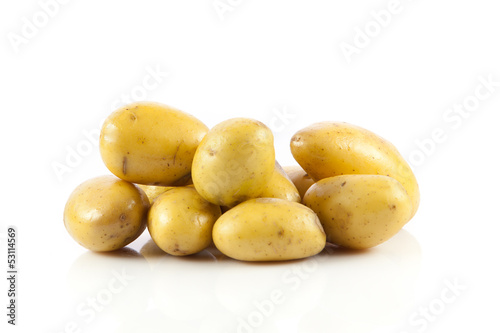 Photo: Fresh potatoes on a white background. Fresh potatoes on a white background.