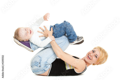 Photo: Beautiful happy mather with attractive baby boy on white. Portra Beautiful happy mather with attractive baby boy on white. Portra