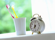 Toothbrush and alarm clock