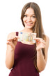 Portrait of young woman holding 50 Euro banknote