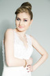 portrait of young bride in white dress with nose piercing