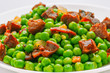 sauteed pea dish with ham and chorizo