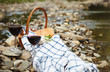 Photo: Red wine, cheese and bread served at a picnic Red wine, cheese and bread served at a picnic