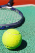 Close up of tennis racquet and ball