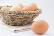 Eggs in the basket on a white background