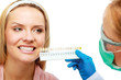 dentist at work on woman patient in office