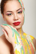 Beautiful woman painted with many vivid colors.