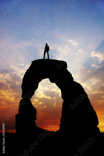 Illustration: man on rock at sunset man on rock at sunset