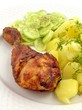 grilled chicken leg with potatoes and cucumber