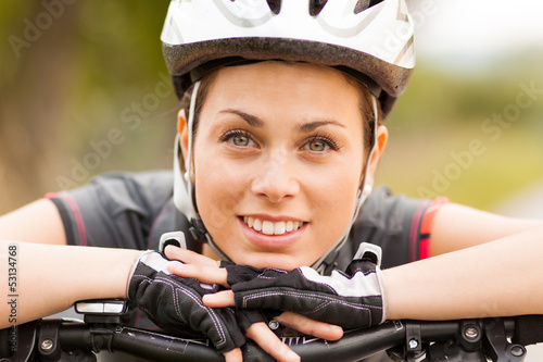 Photo: Portrait of woman with mountain bike Portrait of woman with mountain bike