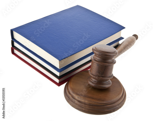 Photo: wooden mallet and a book wooden mallet and a book