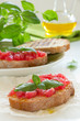 Photo: Bruschetta with tomato, basil and olive oil. Bruschetta with tomato, basil and olive oil.