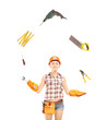 Photo: Female manual worker juggling with tools Female manual worker juggling with tools