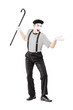 Foto: Full length portrait of a mime artist holding a cane and gesturi Full length portrait of a mime artist holding a cane and gesturi