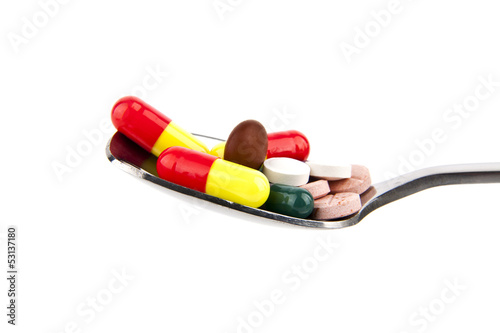 Photo: pills in a spoon pills in a spoon