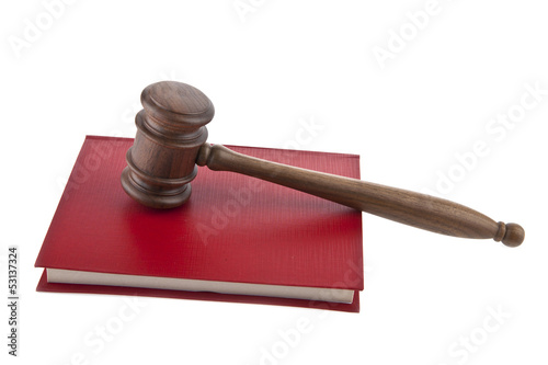Photo: wooden mallet and a book wooden mallet and a book