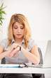 woman looking at hand watch