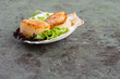 Freshly cooked scallops on a shell