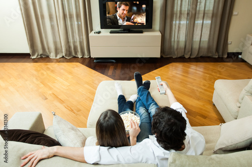 Photo: Couple watching a movie Couple watching a movie