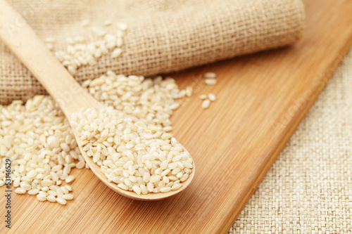 Photo: Uncooked rice on spoon Uncooked rice on spoon