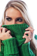 Woman hiding her face with her sweater collar